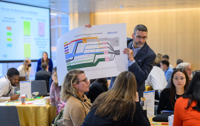 MCSC Executive Director Jeremy Gregory interacts with a diagram depicting materials and energy flows. Photo by Gretchen Ertl.